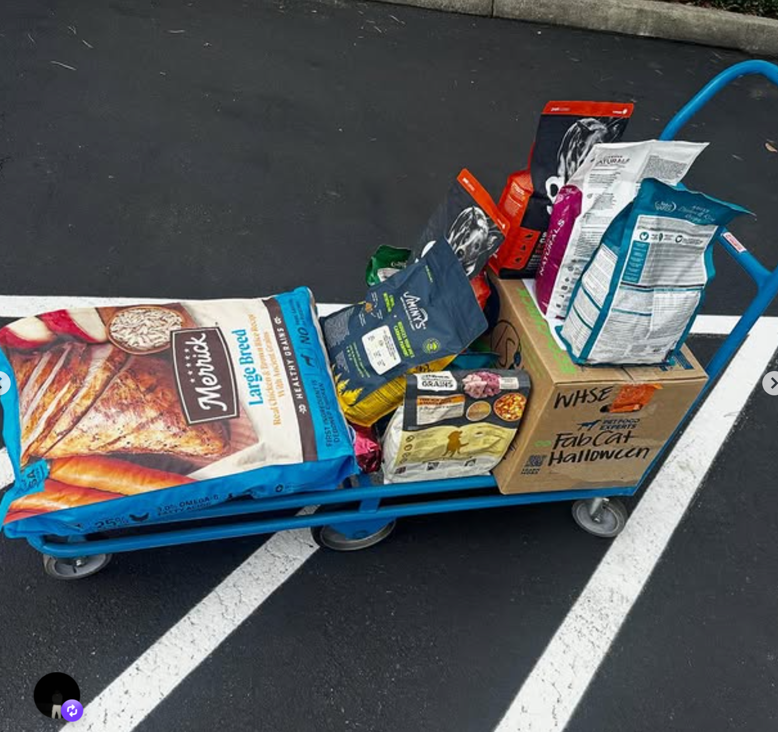 A cart carrying donated pet food and supplies