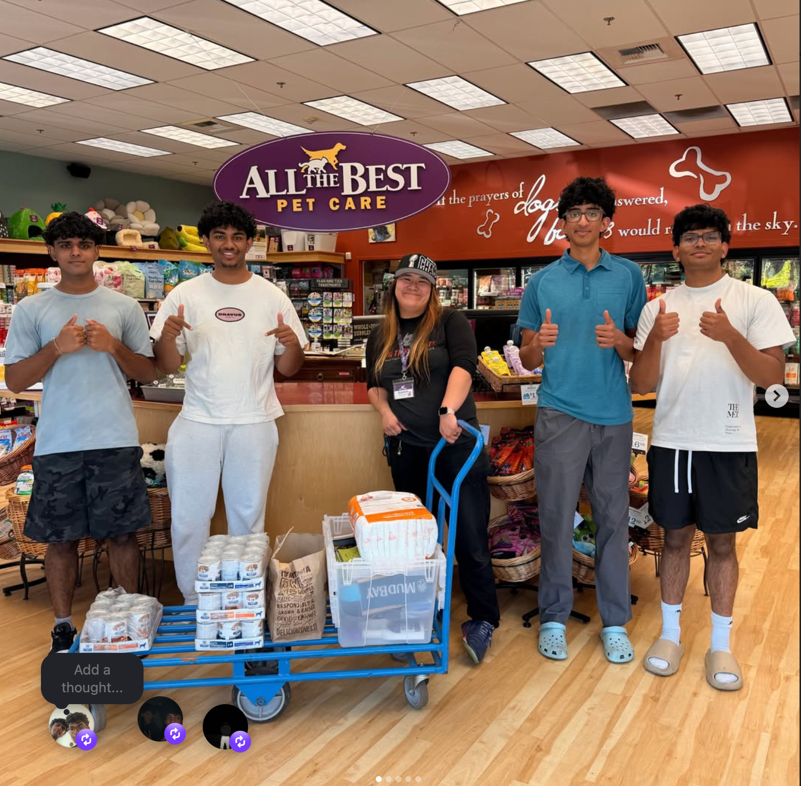 Mochi team members with a community pet-care partner